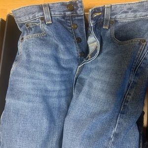 Saint Laurent
block-heel denim trouser boots. Jean fits size 2-4 rums small